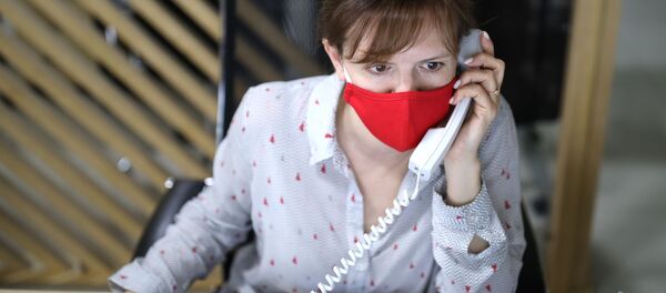 Сотрудник колл-центра, архивное фото Сотрудник колл-центра, архивное фото - Sputnik Таджикистан