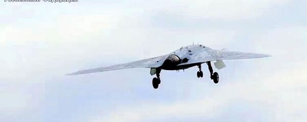 Новейший ударный беспилотник Охотник совершил первый совместный полет с Су-57 - Sputnik Тоҷикистон