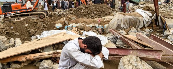 Поиск жертв наводнения в Афганистане Поиск жертв наводнения в Афганистане - Sputnik Тоҷикистон