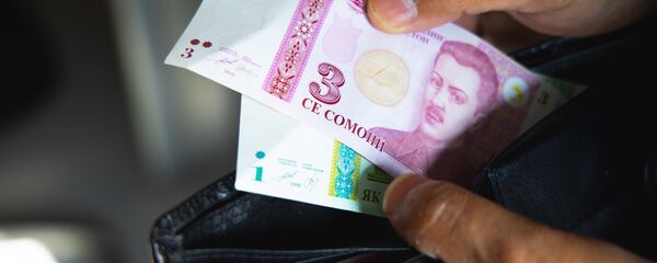 Кошелек с деньгами, архивное фото Кошелек с деньгами, архивное фото - Sputnik Тоҷикистон