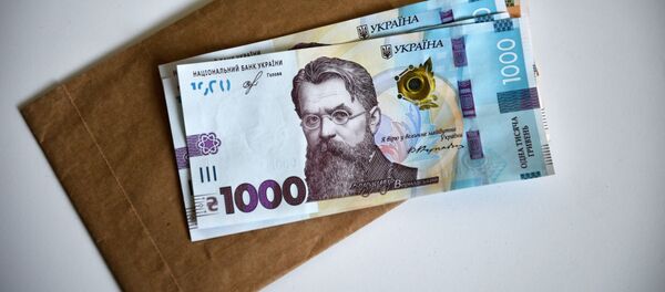 Банкноты номиналом 1000 гривен Банкноты номиналом 1000 гривен - Sputnik Таджикистан