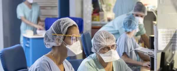 Врачи в больнице Врачи в больнице - Sputnik Тоҷикистон