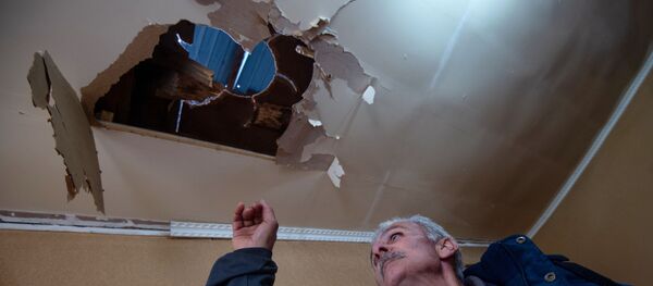 Дом, поврежденный в результате обстрела общины Иванян Нагорного Карабаха - Sputnik Тоҷикистон