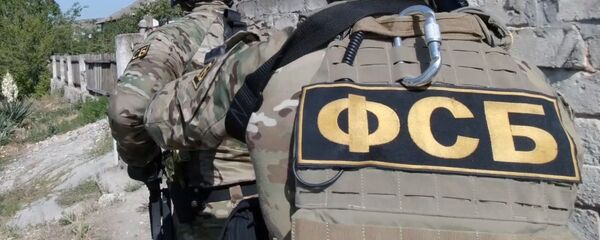 Задержание сотрудниками ФСБ РФ, архивное фото Задержание сотрудниками ФСБ РФ, архивное фото - Sputnik Таджикистан