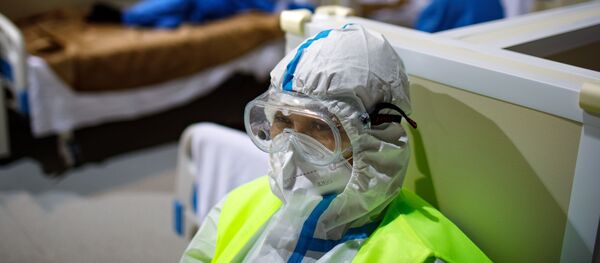 Госпиталь COVID-19 в ледовом комплексе Крылатское - Sputnik Тоҷикистон