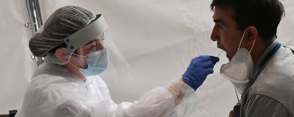 Экспресс-тестирование пассажиров на COVID-19 в аэропорту Внуково Экспресс-тестирование пассажиров на COVID-19 в аэропорту Внуково - Sputnik Таджикистан