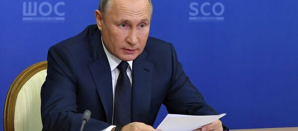 Президент РФ Владимир Путин проводит в режиме видеоконференции заседание Совета глав государств - членов Шанхайской организации сотрудничества (ШОС) - Sputnik Таджикистан