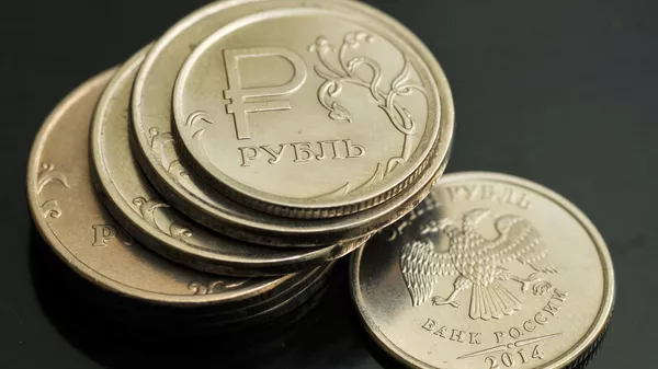 Монеты номиналом 1 рубль.  - Sputnik Тоҷикистон