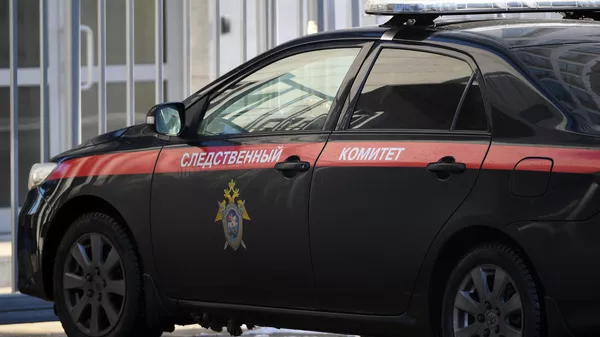 Служебный автомобиль возле здания Следственного комитета РФ в Москве. - Sputnik Тоҷикистон