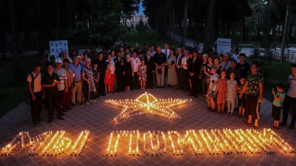 Международная акция Свеча памяти прошла в Бустоне - Sputnik Таджикистан
