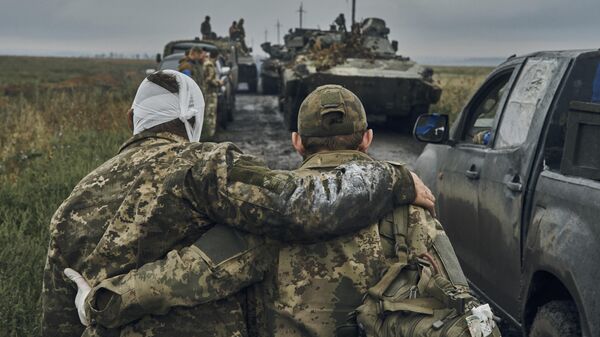 Раненые украинские военнослужащие под Харьковом. Архивное фото - Sputnik Таджикистан