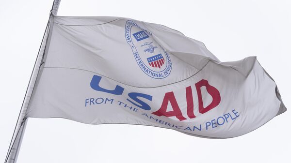 Флаг Агентства США по международному развитию (USAID)  - Sputnik Тоҷикистон