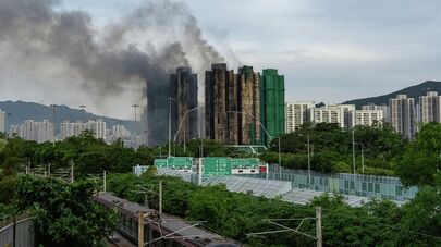 Последствия пожара в жилом комплексе "Ван Фук Корт" в Гонконге