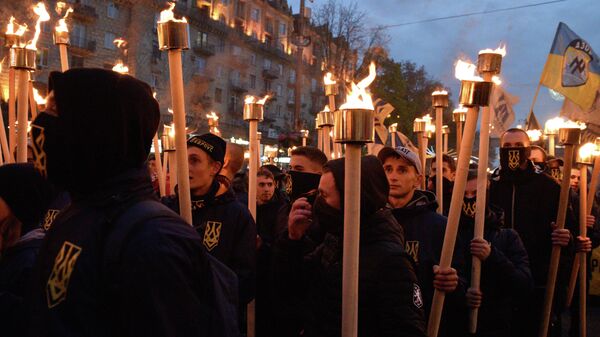 Участники марша в Киеве, приуроченного к годовщине создания Украинской повстанческой армии (УПА, экстремистская организация, запрещена в России) и Дню защитника Украины.  - Sputnik Таджикистан