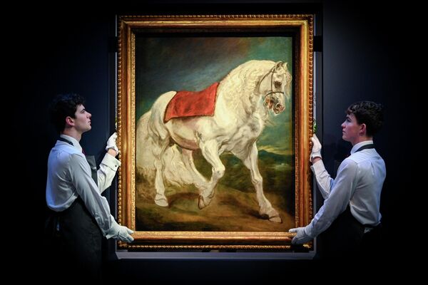 Представители аукционного дома Christie's представляют картину Антони ван Дейка "Андалузская лошадь" 29 ноября 2024 года в Лондоне, Англия. Среди наиболее примечательных лотов этих предрождественских торгов - единственный сохранившийся пейзаж маслом работы ван Дейка, оригинальные рисунки медведя Паддингтона, выполненные иллюстратором Пегги Фортнум, подписанная рукопись Бетховена и несколько картин Рембрандта. - Sputnik Таджикистан