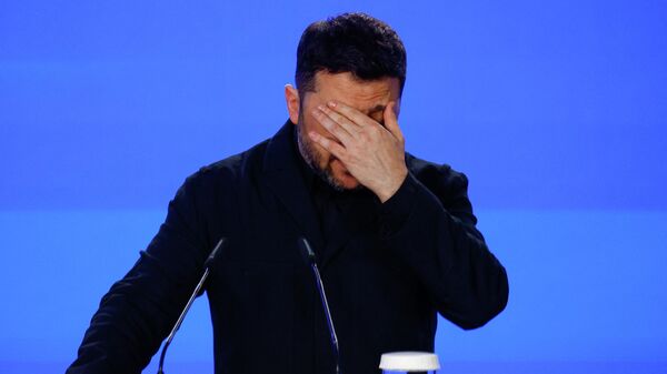 Владимир Зеленский выступает на пресс-конференции в Киеве, Украина, 24 февраля 2026 года.  - Sputnik Тоҷикистон