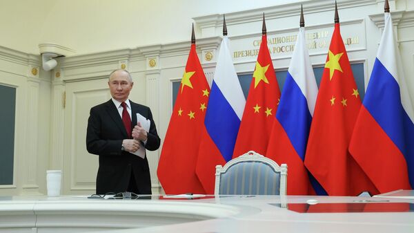 Президент Владимир Путин провел видеоконференцию с председателем КНР Си Цзиньпином - Sputnik Таджикистан