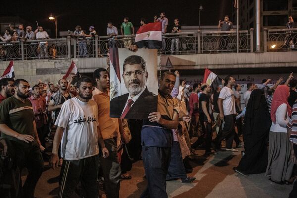 Марш сторонников М.Мурси к президентскому дворцу в Каире. Архивное фото - Sputnik Таджикистан