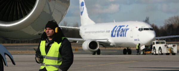 Самолёт авиакомпании ЮТэйр. Архивное фото Самолёт авиакомпании ЮТэйр. Архивное фото - Sputnik Тоҷикистон