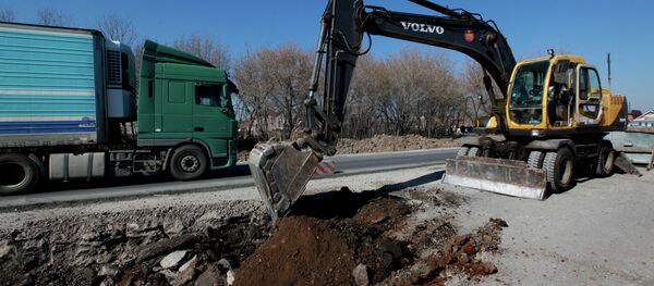 Ремонт автотрассы. Архивное фото Ремонт автотрассы. Архивное фото - Sputnik Таджикистан
