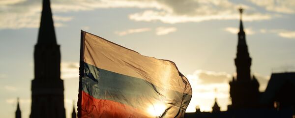 Российский флаг на Красной площади. Архивное фото Российский флаг на Красной площади. Архивное фото - Sputnik Таджикистан