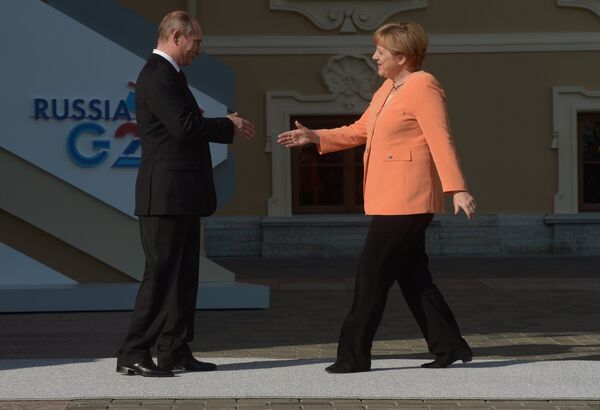 Президент России В. Путин и канцлер Германии Ангела Меркель. Архивное фото - Sputnik Таджикистан