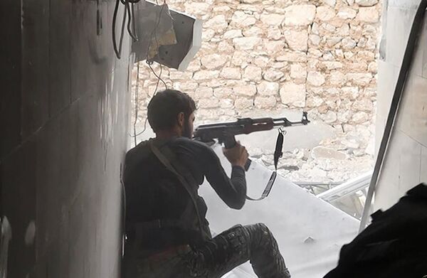 Боевик ИГ в Сирии. Архивное фото - Sputnik Таджикистан