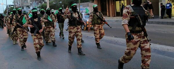Представители движения Хамас маршируют по улице. Архивное фото Представители движения Хамас маршируют по улице. Архивное фото - Sputnik Таджикистан