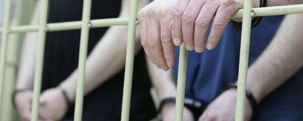 Подозреваемые в наручниках, архивное фото - Sputnik Тоҷикистон