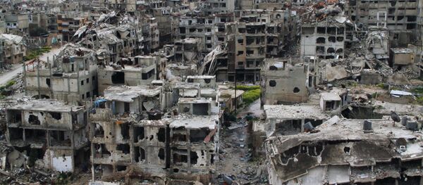 Разрушенные дома в результате боевых действий дома в Хомсе, Сирия. Архивное фото. Разрушенные дома в результате боевых действий дома в Хомсе, Сирия. Архивное фото. - Sputnik Таджикистан