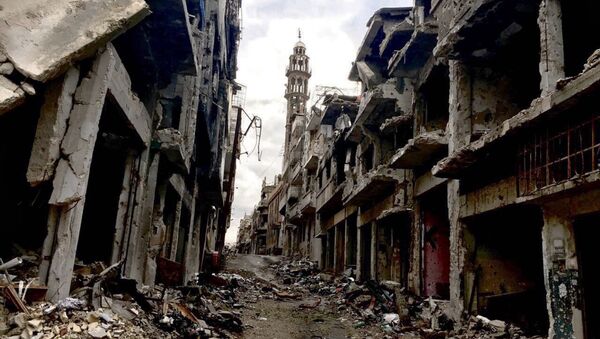 Разрушенные здания в сирийском городе Хомсе. Архивное фото - Sputnik Таджикистан