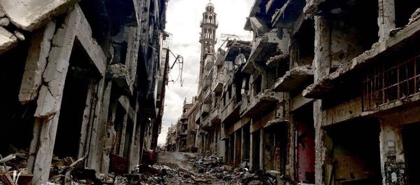 Разрушенные здания в сирийском городе Хомсе. Архивное фото Разрушенные здания в сирийском городе Хомсе. Архивное фото - Sputnik Таджикистан