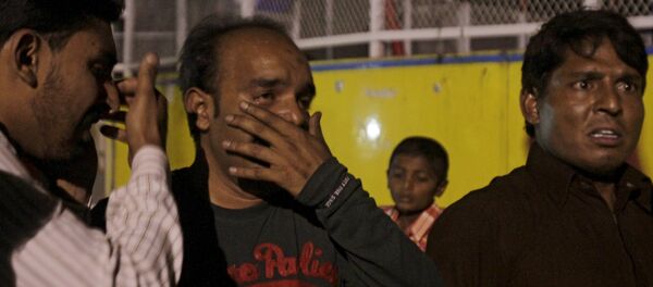 Одамон дар маҳалли инфиҷор дар Лоҳури Покистон Одамон дар маҳалли инфиҷор дар Лоҳури Покистон - Sputnik Тоҷикистон