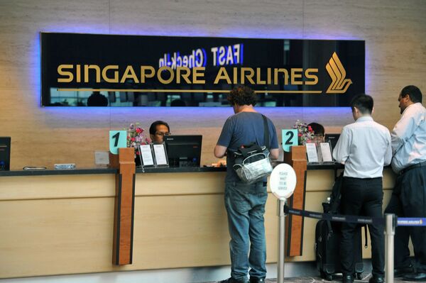 Стойка регистрации Singapore Airlines в аэропорту. Архивное фото - Sputnik Таджикистан