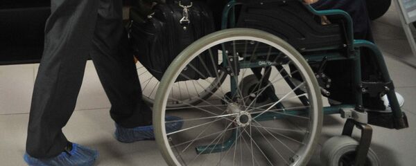 Инвалид-колясочник. Архивное фото - Sputnik Тоҷикистон
