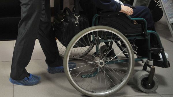 Инвалид-колясочник. Архивное фото - Sputnik Таджикистан