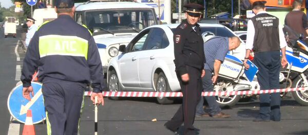 Сотрудники СК РФ работают на месте нападения на пост ГИБДД в Подмосковье Сотрудники СК РФ работают на месте нападения на пост ГИБДД в Подмосковье - Sputnik Таджикистан