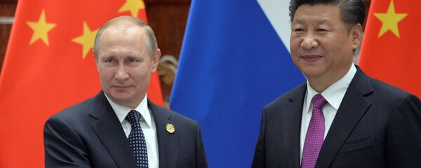Президент РФ Владимир Путин и председатель КНР Си Цзиньпин на саммите G20 - Sputnik Таджикистан