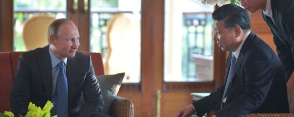 Президент РФ Владимир Путин и председатель Китайской Народной Республики Си Цзиньпин Президент РФ Владимир Путин и председатель Китайской Народной Республики Си Цзиньпин - Sputnik Таджикистан