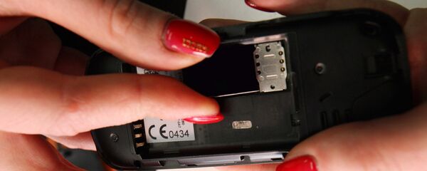 Замена сим-карты, архивное фото - Sputnik Тоҷикистон