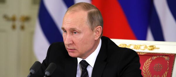 Президенти Русия Владимир Путин, акс аз бойгонӣ Президенти Русия Владимир Путин, акс аз бойгонӣ - Sputnik Тоҷикистон