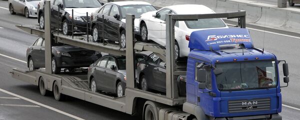 Перевозка новых иномарок, архивное фото Перевозка новых иномарок, архивное фото - Sputnik Таджикистан