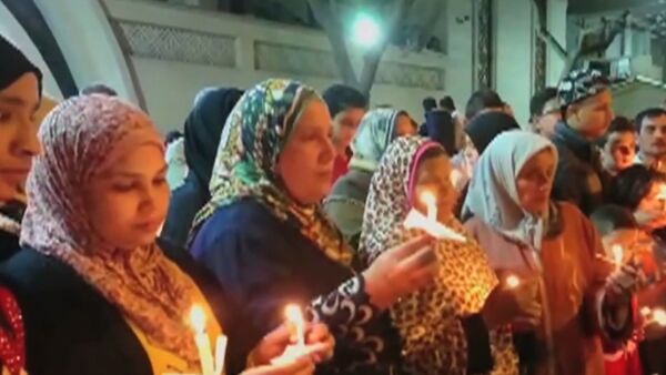 В Египте зажгли свечи в память о жертвах терактов - Sputnik Таджикистан