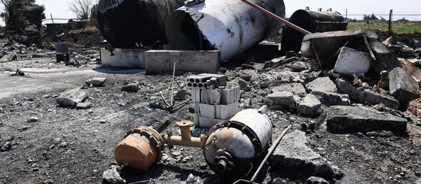 Последствия ракетного удара США по авиабазе Шайрат в Сирии - Sputnik Таджикистан