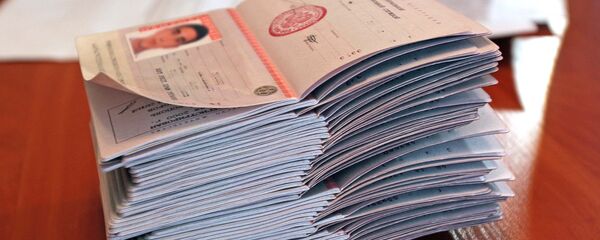 Российский паспорта, архивное фото Российский паспорта, архивное фото - Sputnik Тоҷикистон