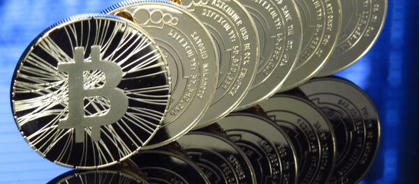 Виртуальная валюта Биткоин, архивное фото Виртуальная валюта Биткоин, архивное фото - Sputnik Таджикистан