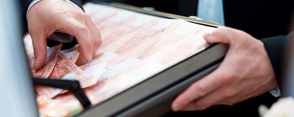 Деньги в кейсе, архивное фото Деньги в кейсе, архивное фото - Sputnik Таджикистан