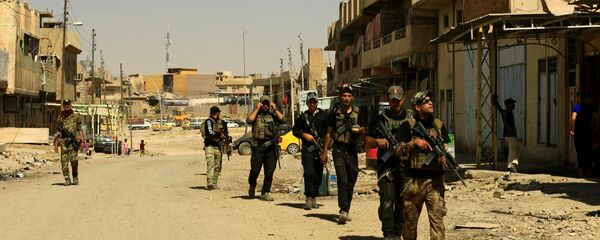 Военные контртеррористического подразделения CTS патрулируют в западном Мосуле, архивное фото Военные контртеррористического подразделения CTS патрулируют в западном Мосуле, архивное фото - Sputnik Таджикистан
