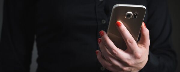 Сотовый телефон, архивное фото - Sputnik Тоҷикистон