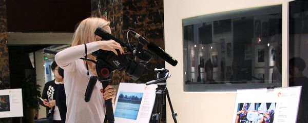 Открытие выставки победителей конкурса им. Андрея Стенина в Пекине - Sputnik Таджикистан